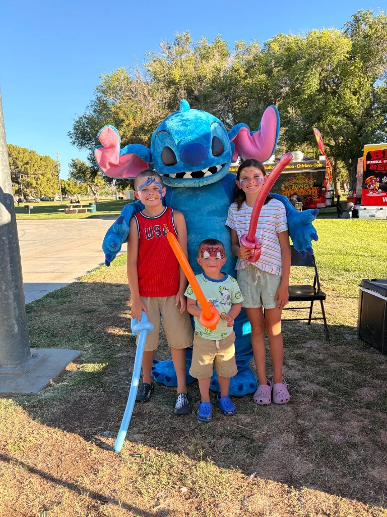 Stitch character with kids at a party event